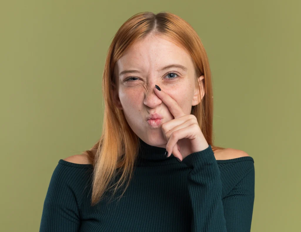a redhead girl with a crooked nose