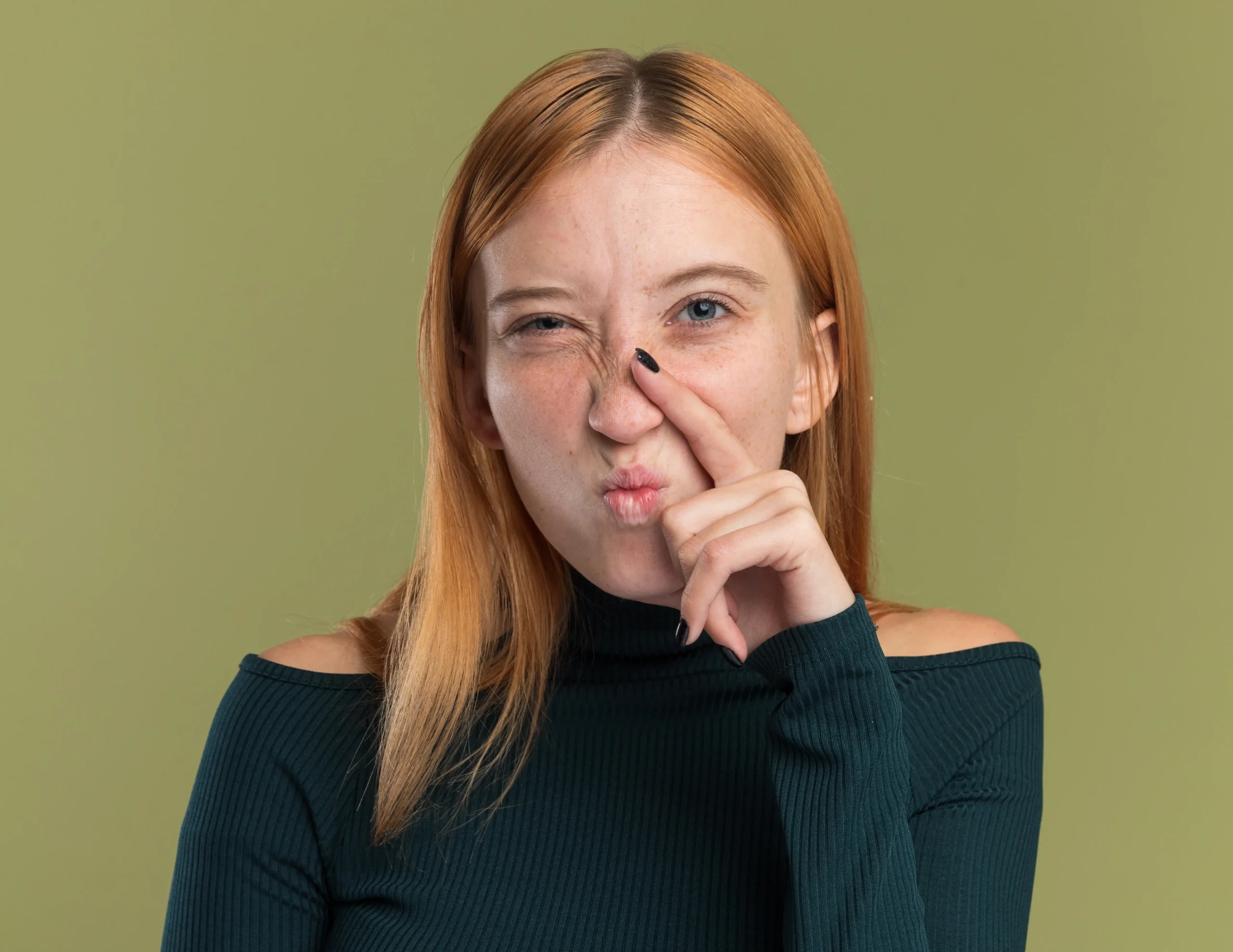 a redhead girl with a crooked nose